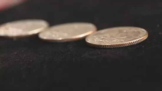 Feather Thru Coin (Quarter) by Roy Kueppers - Trick